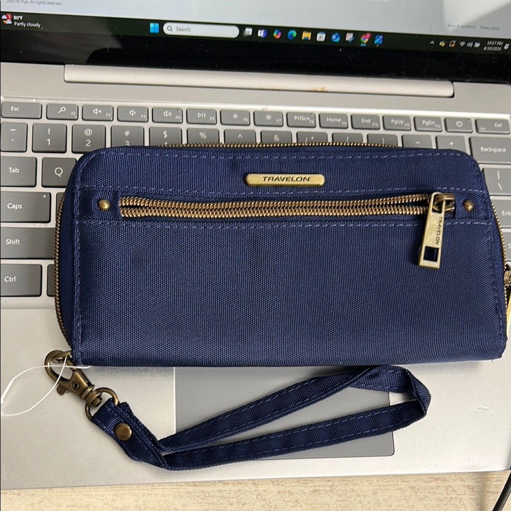 Travelon Blue Wristlet with Gold Accents with RFID blocking technology